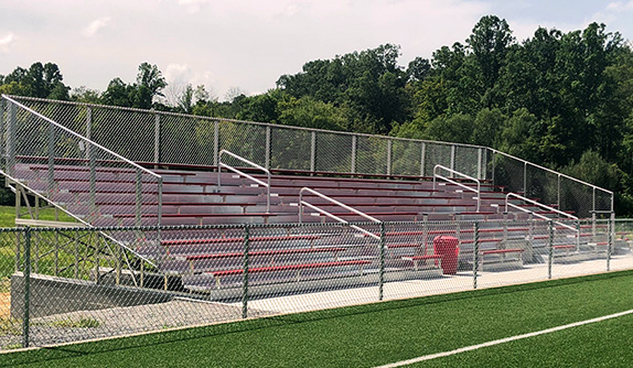 College Adds Aluminum Bleachers With Red Powder-Coated Seats To Promote Team Colors And Inspire Fans