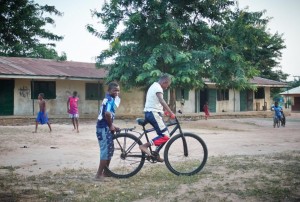 A youngster helps his friend