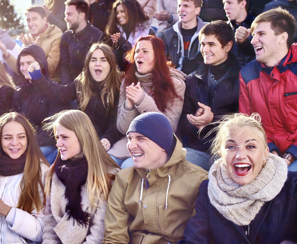 Fans in bleachers on a chilly day