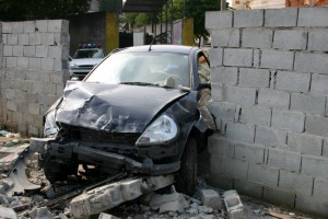 car crashes into wall