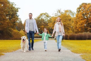 family takes a walk in park