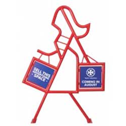 Commercial bike racks in the shape of a lady shopping.